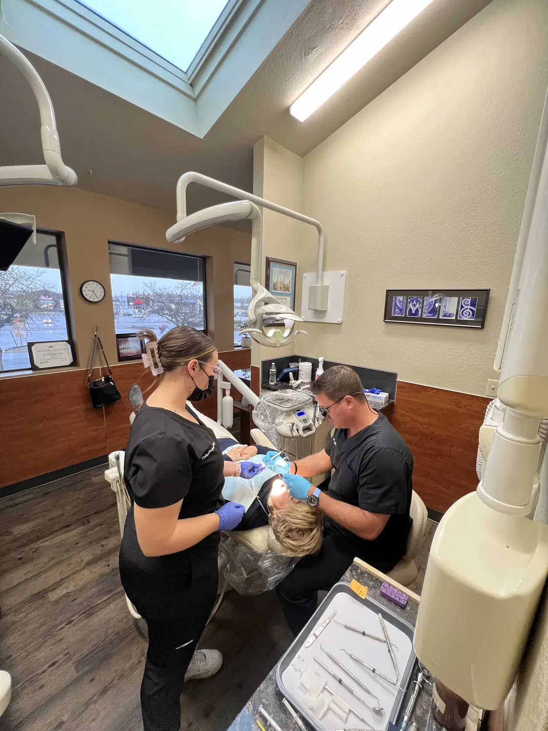 Dr. Collins and a team member providing care inside the Cheney practice